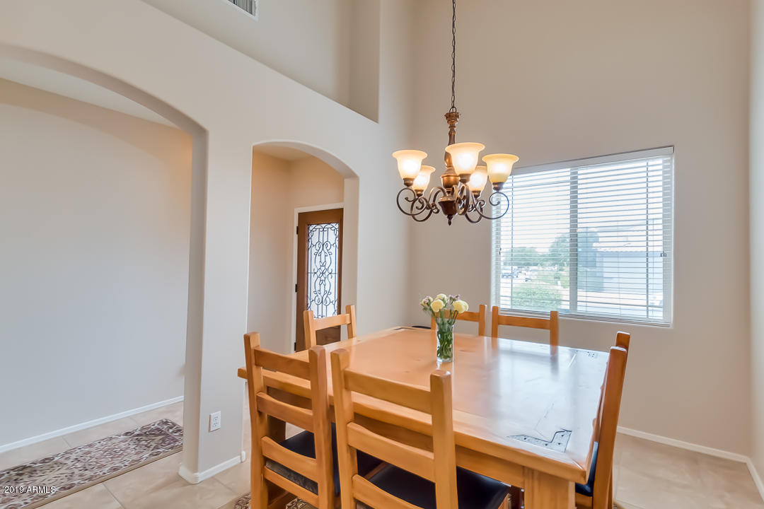 19216 North Lariat Road Maricopa, AZ 85138 - Photo 12 of 40 a dining room with furniture and window