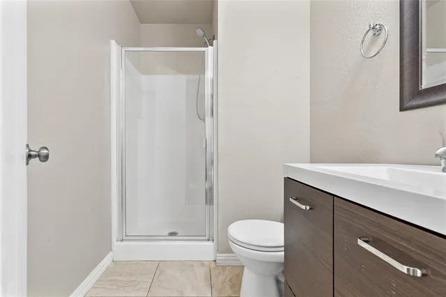 a bathroom with a sink a toilet and vanity