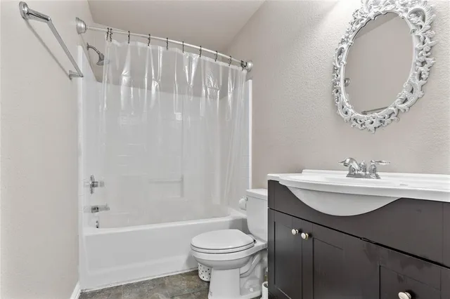 a view of a swimming pool with a patio and yard of the house