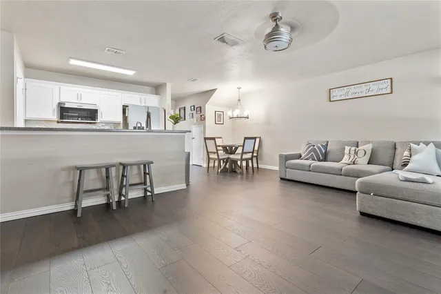 a living room with furniture and a table