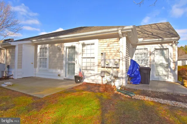 a view of an house with swimming pool and porch