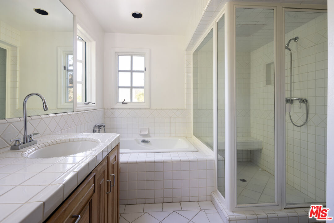 200 Mabery Road Santa Monica, CA 90402 - Photo 12 of 18 a bathroom with a tub sink and mirror