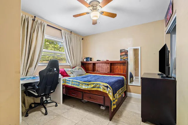 a bedroom with a bed and furniture