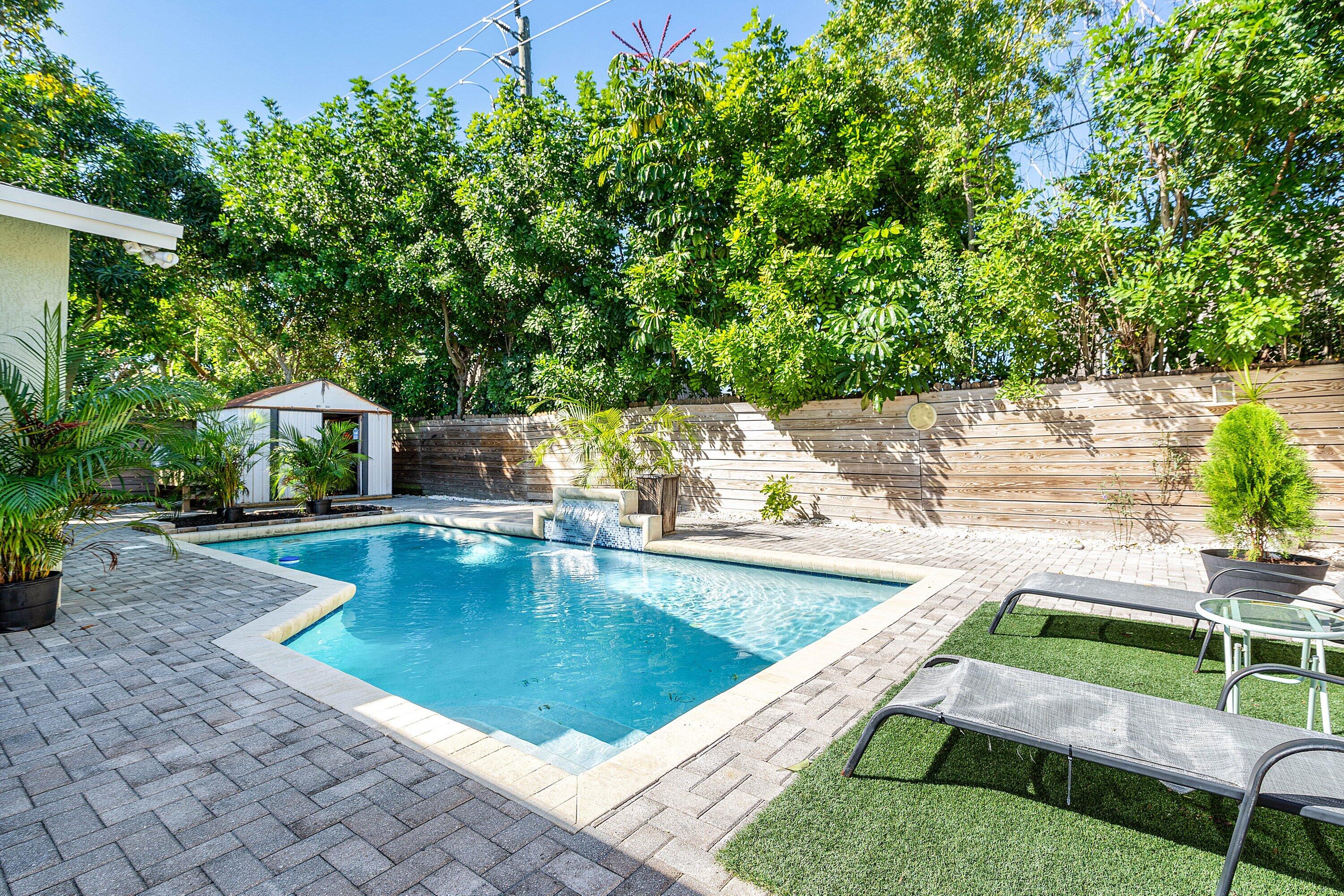 22207 Southwest 65th Terrace Boca Raton, FL 33428 - Photo 22 of 27 a view of a swimming pool with a patio
