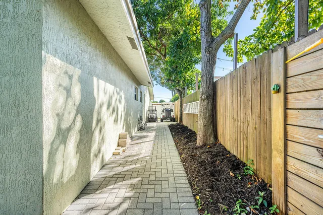 a view of a pathway of a house with wooden floor
