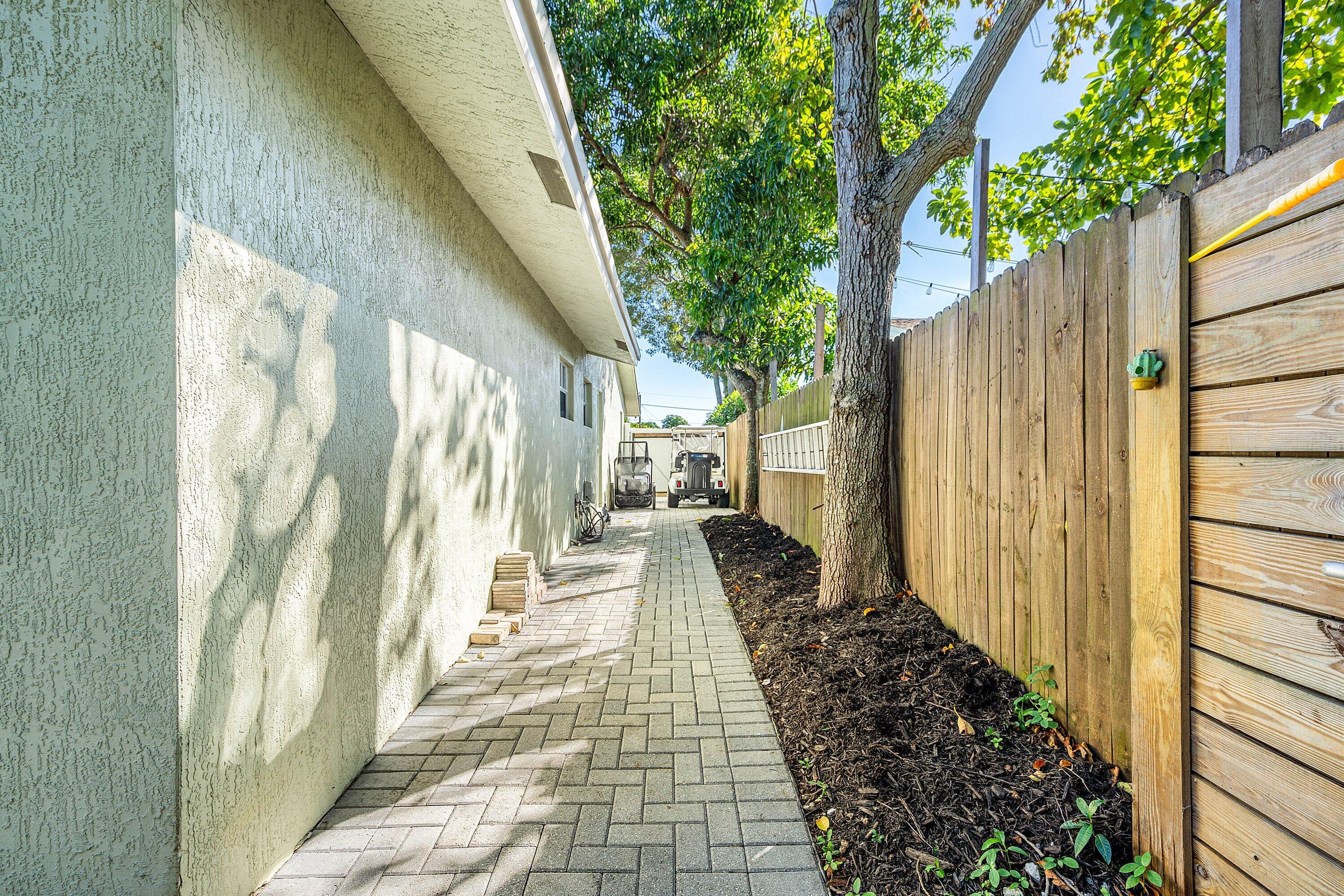 22207 Southwest 65th Terrace Boca Raton, FL 33428 - Photo 27 of 27 a view of a pathway of a house with wooden floor
