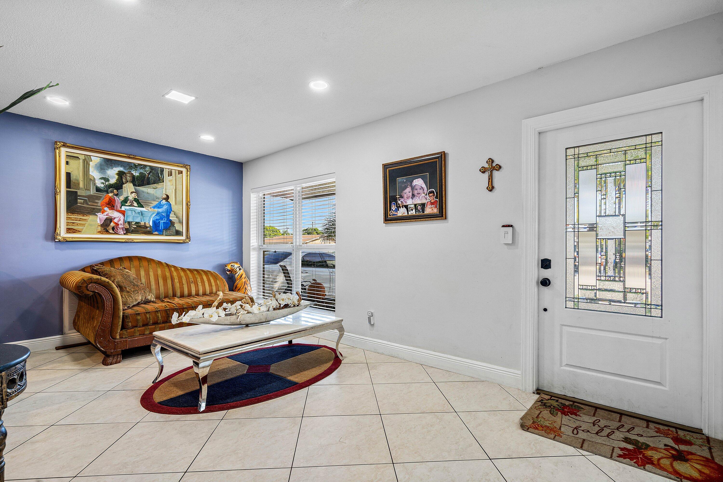 22207 Southwest 65th Terrace Boca Raton, FL 33428 - Photo 5 of 27 a living room with furniture and a window