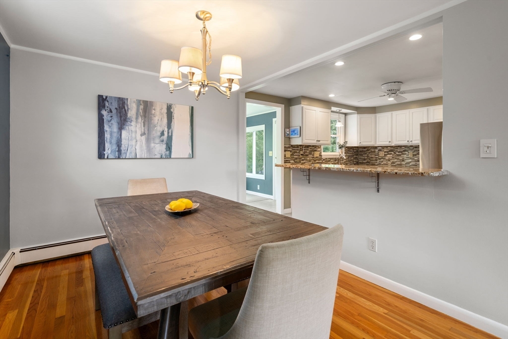 26 Crest Road Framingham, MA 01702 - Photo 13 of 39 a view of a dining room with furniture and a chandelier