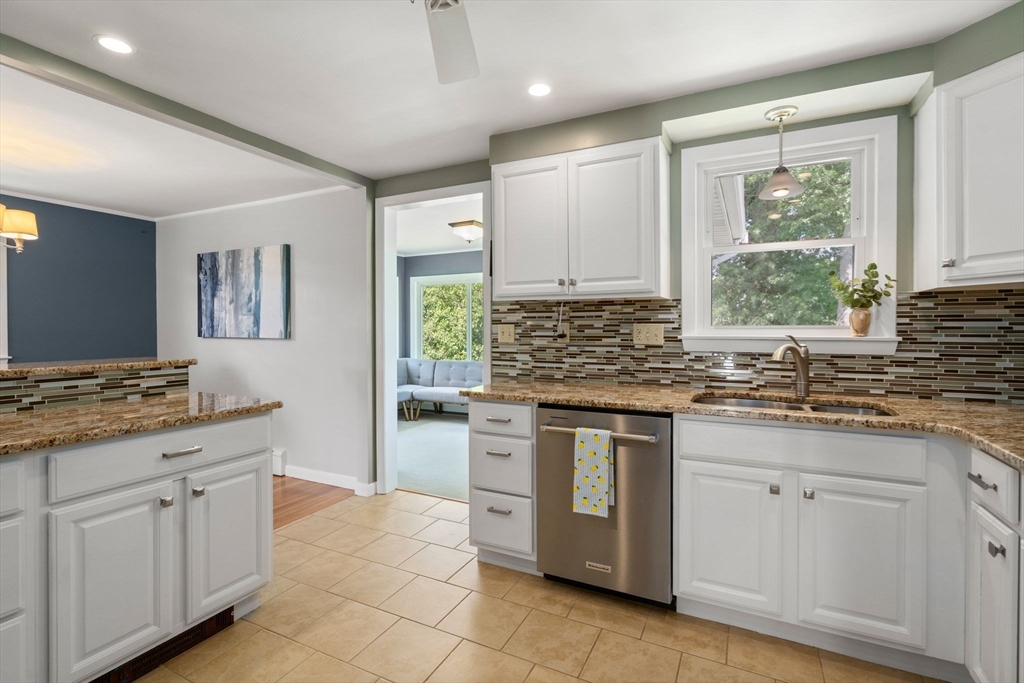 26 Crest Road Framingham, MA 01702 - Photo 14 of 39 a kitchen with stainless steel appliances granite countertop a stove a sink and a refrigerator