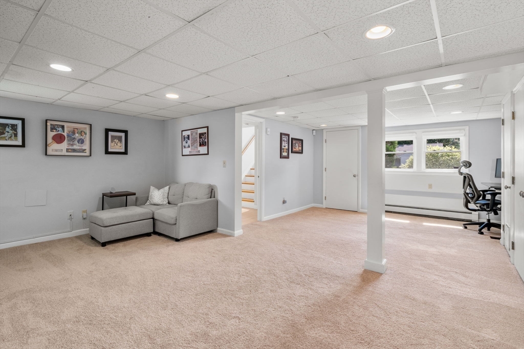 26 Crest Road Framingham, MA 01702 - Photo 25 of 39 a living room with furniture and a flat screen tv
