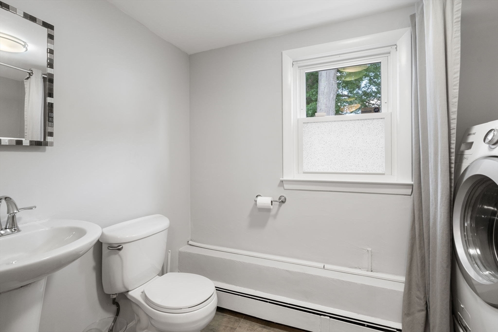 26 Crest Road Framingham, MA 01702 - Photo 30 of 39 a bathroom with a sink a toilet and a mirror