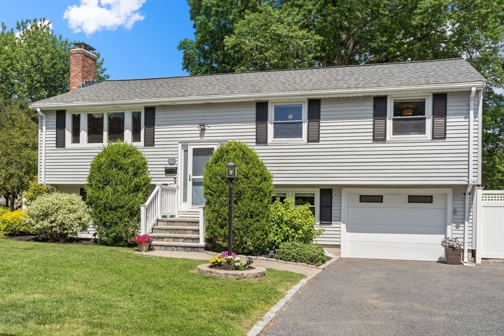 26 Crest Road Framingham, MA 01702 - Photo 3 of 39 a front view of a house with a yard