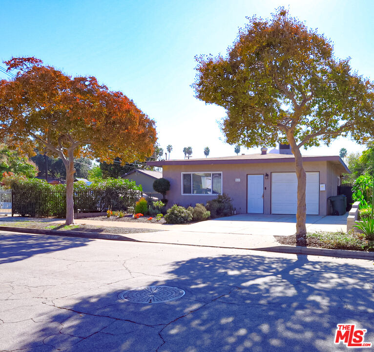 262 MacDonald Street Pasadena, CA 91103 - Photo 1 of 22 a wooden house with tree in front of it