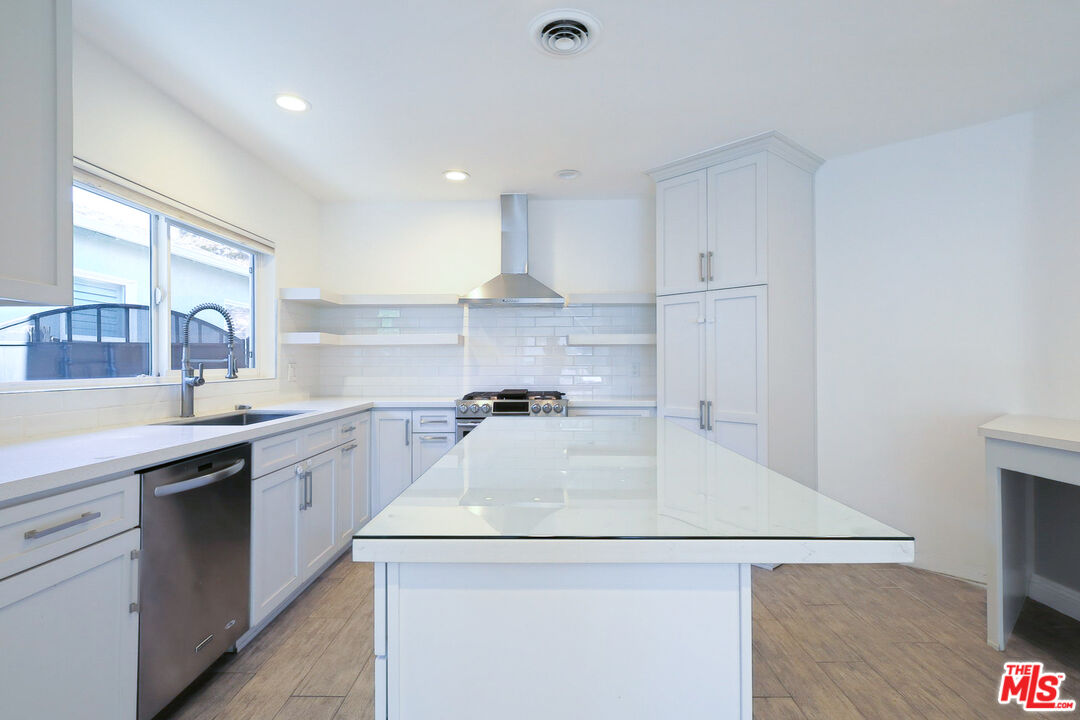 262 MacDonald Street Pasadena, CA 91103 - Photo 4 of 22 a kitchen with a sink a stove and cabinets
