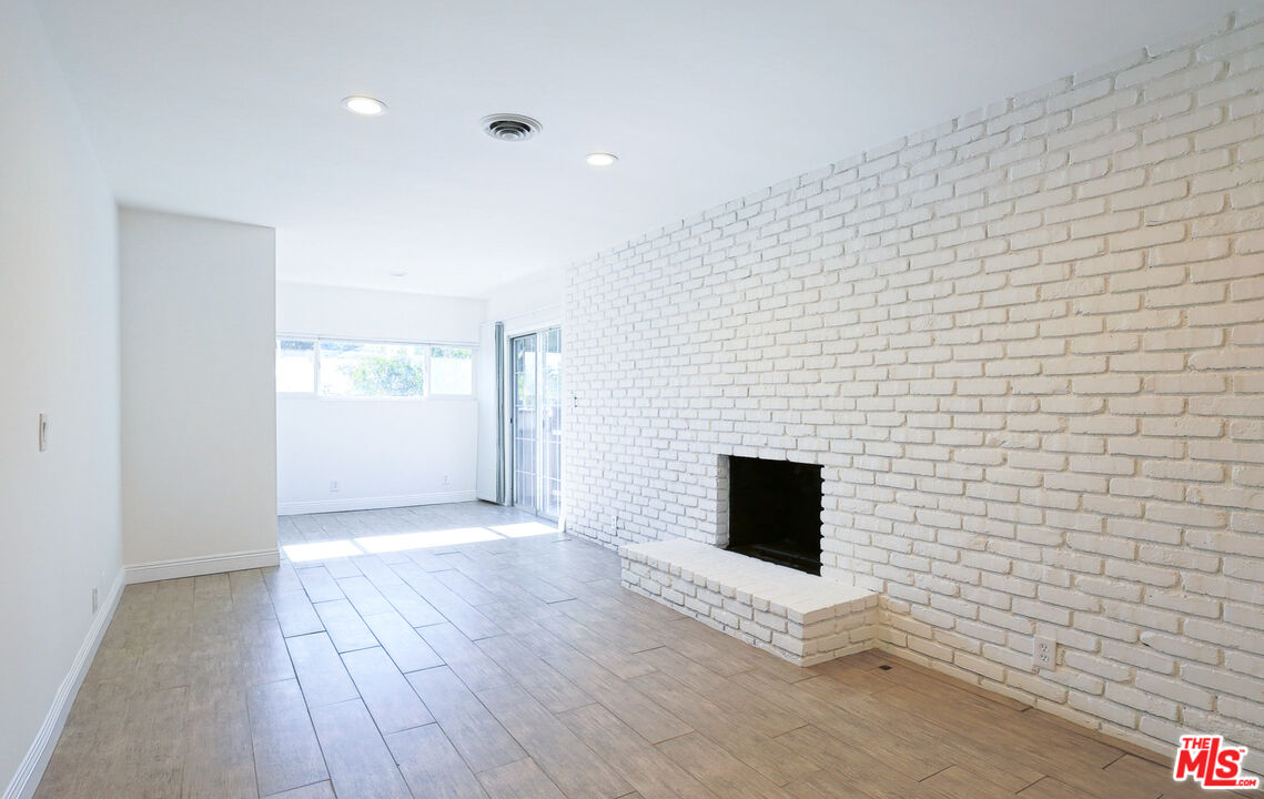 262 MacDonald Street Pasadena, CA 91103 - Photo 6 of 22 a view of a livingroom with wooden floor and a ceiling fan