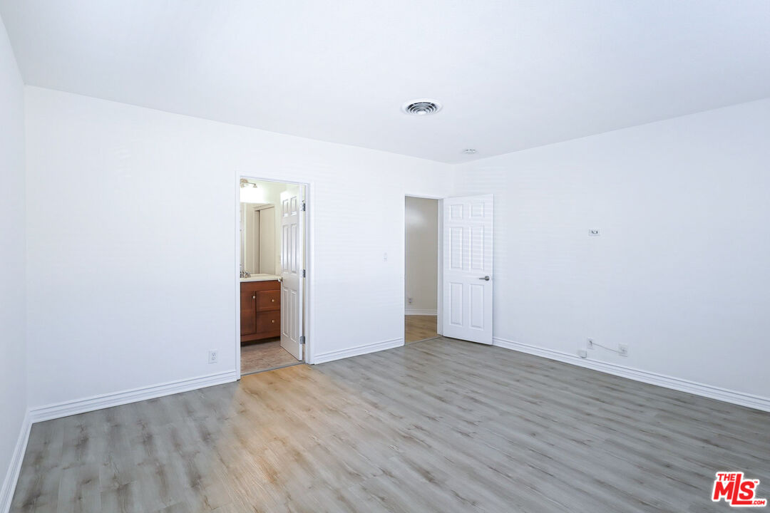 262 MacDonald Street Pasadena, CA 91103 - Photo 8 of 22 a view of an empty room with wooden floor