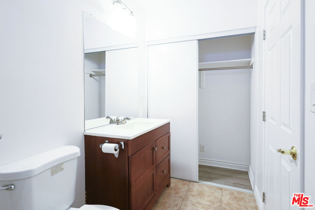 262 MacDonald Street Pasadena, CA 91103 - Photo 10 of 22 a bathroom with a sink vanity and a toilet