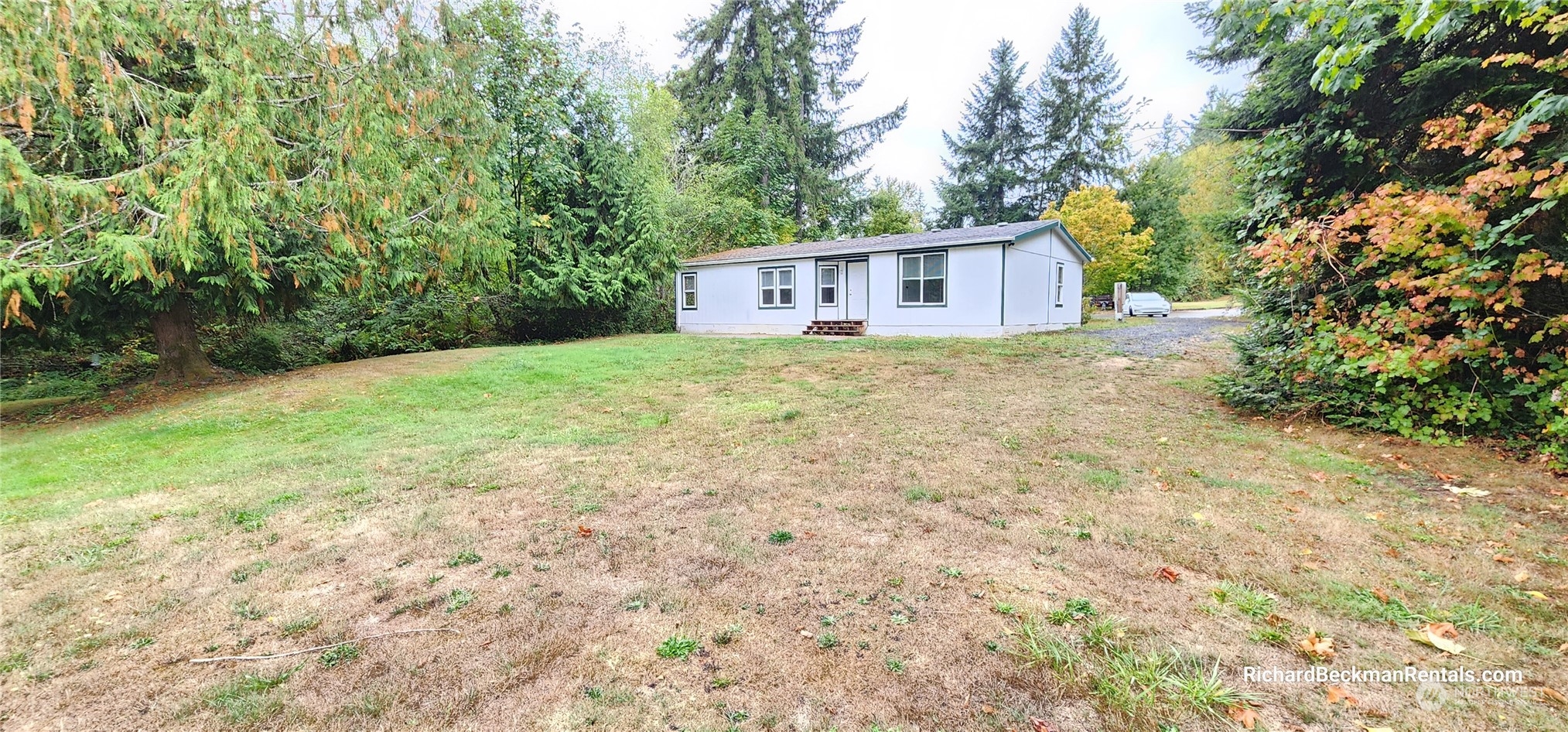40 Southeast My Road Shelton, WA 98584 - Photo 1 of 25 a view of a house with a yard and trees