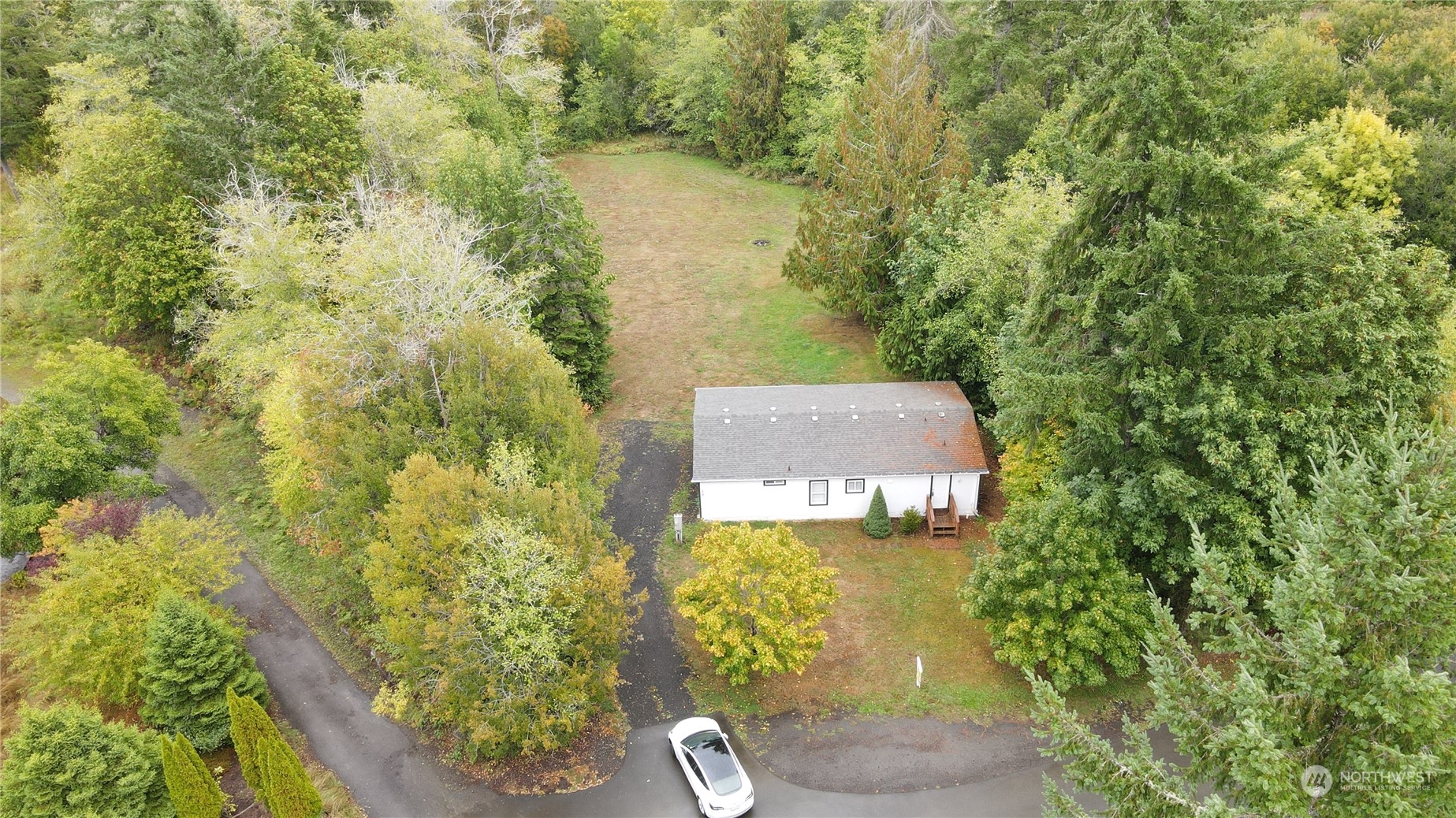 40 Southeast My Road Shelton, WA 98584 - Photo 25 of 25 a aerial view of a house with a yard and large trees all around