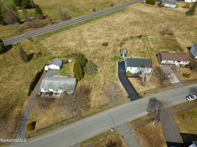 an aerial view of residential house with outdoor space