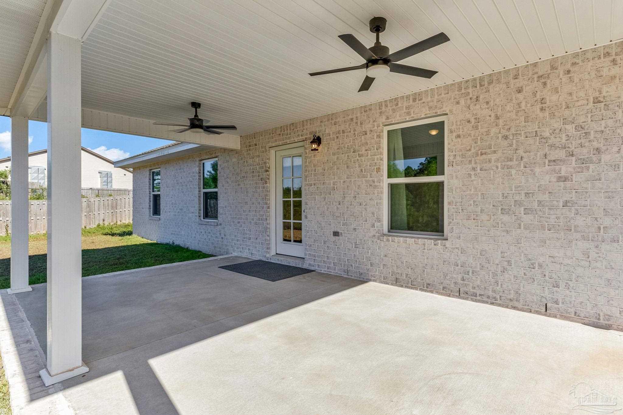 295 West Kingsfield Road Cantonment, FL 32533 - Photo 16 of 47 a view of a livingroom with a ceiling fan and window