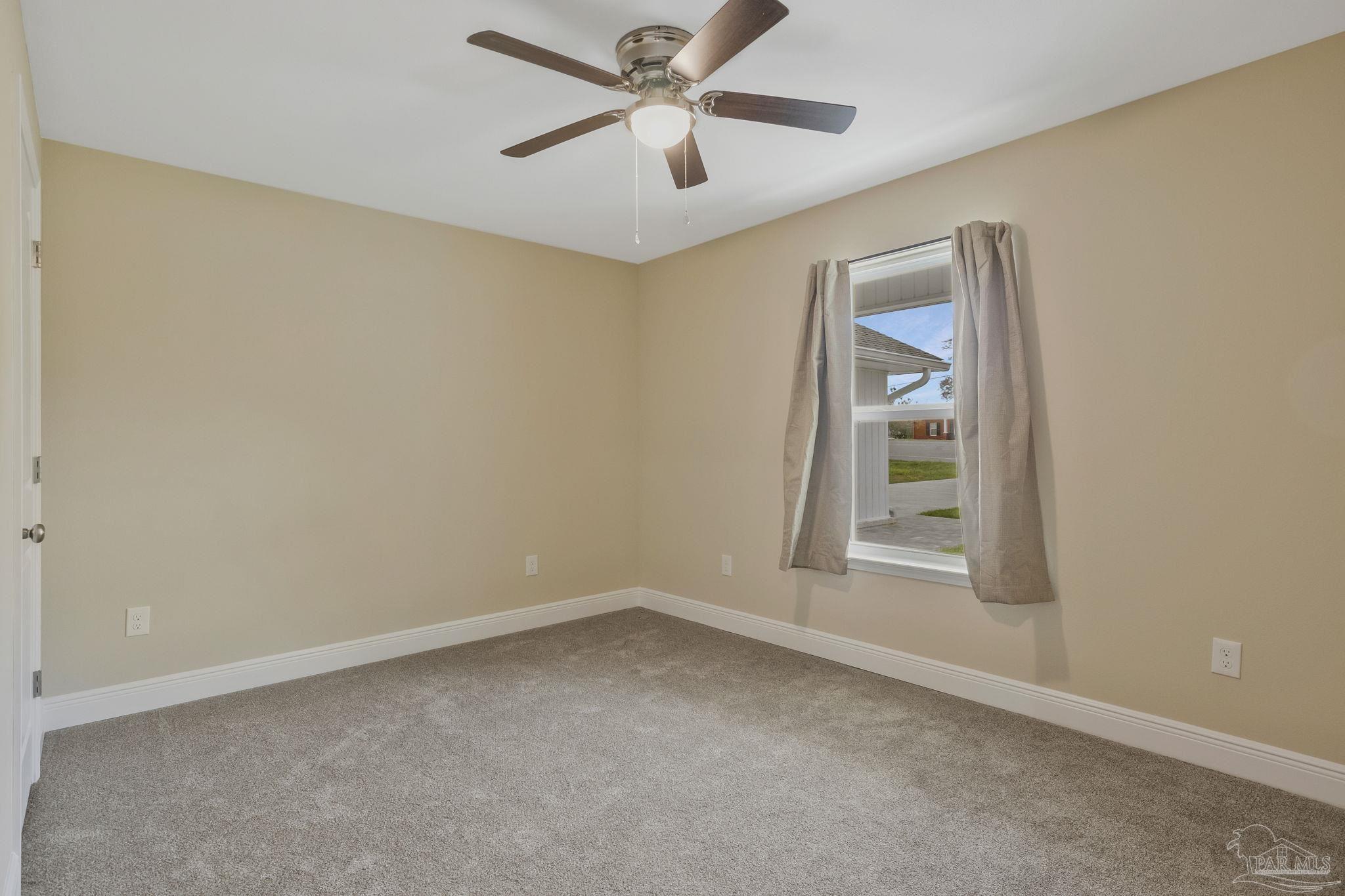 295 West Kingsfield Road Cantonment, FL 32533 - Photo 25 of 47 an empty room with a window and a ceiling fan