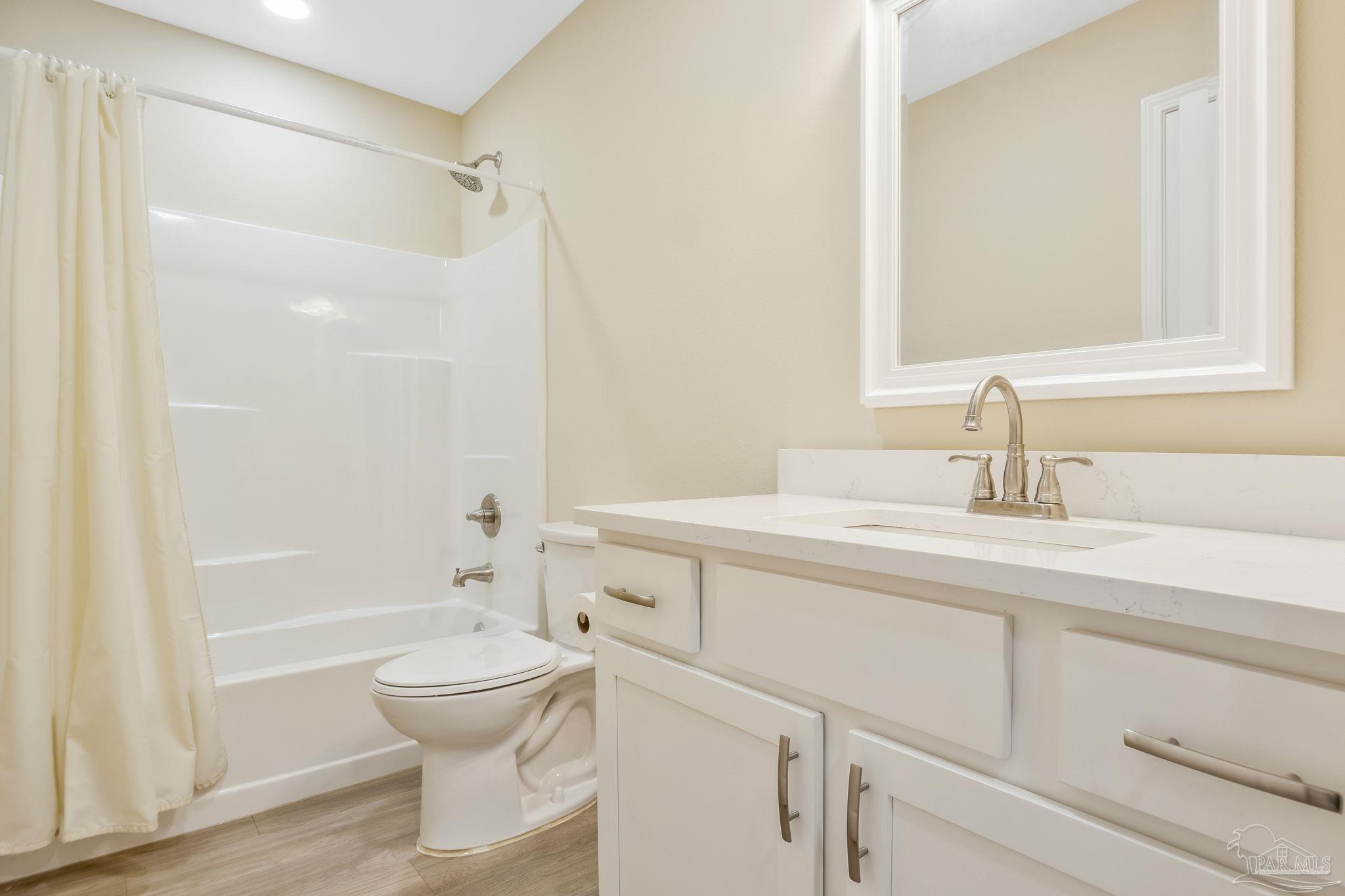 295 West Kingsfield Road Cantonment, FL 32533 - Photo 26 of 47 a bathroom with a sink a toilet and shower