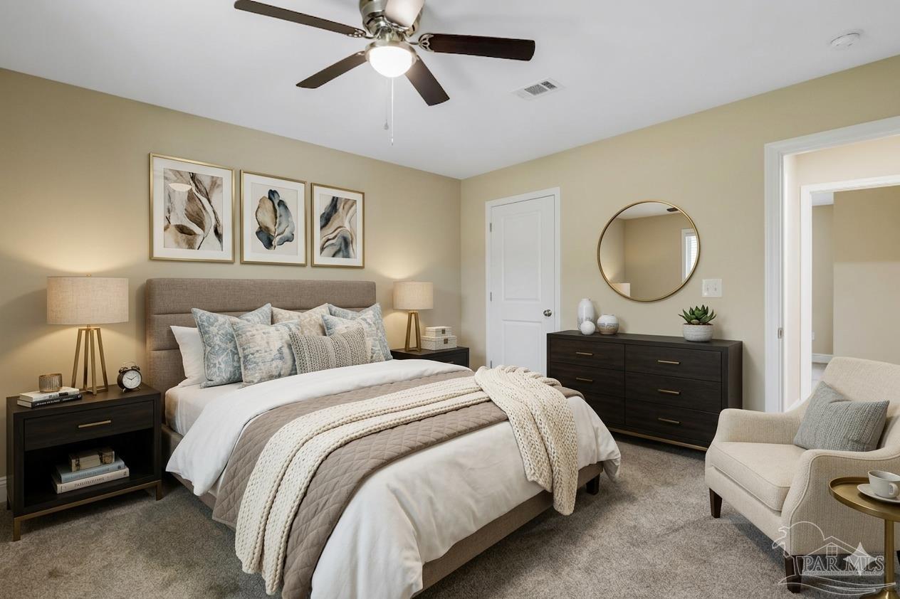 295 West Kingsfield Road Cantonment, FL 32533 - Photo 32 of 47 a bedroom with a bed and wooden floor