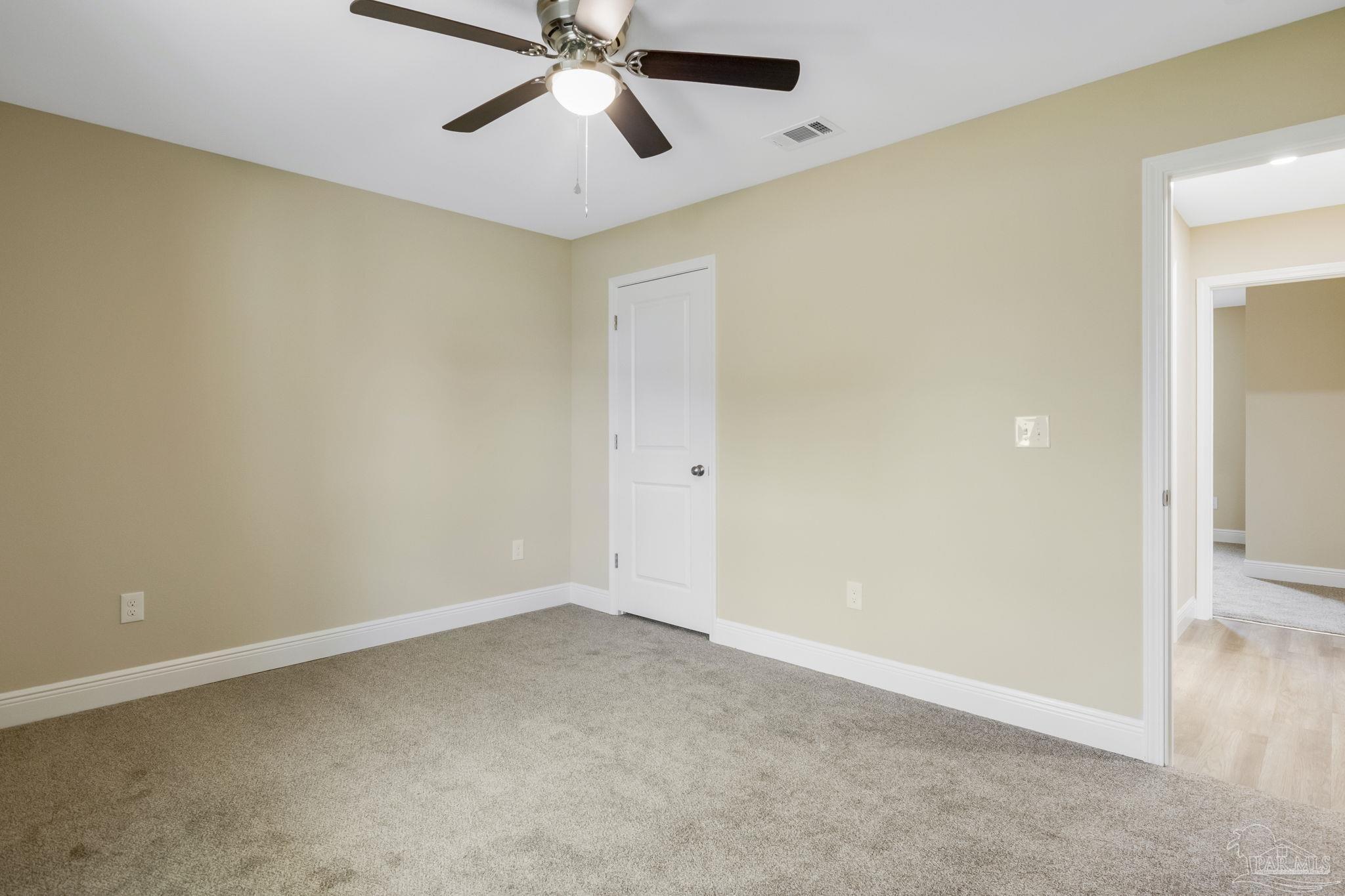 295 West Kingsfield Road Cantonment, FL 32533 - Photo 33 of 47 an empty room with a window and a fan