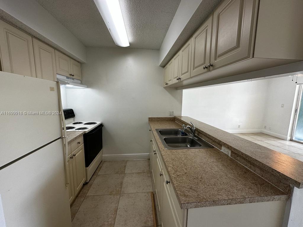 5654 Rock Island Road, Unit 220 Tamarac, FL 33319 - Photo 1 of 15 Gallery Image 1
