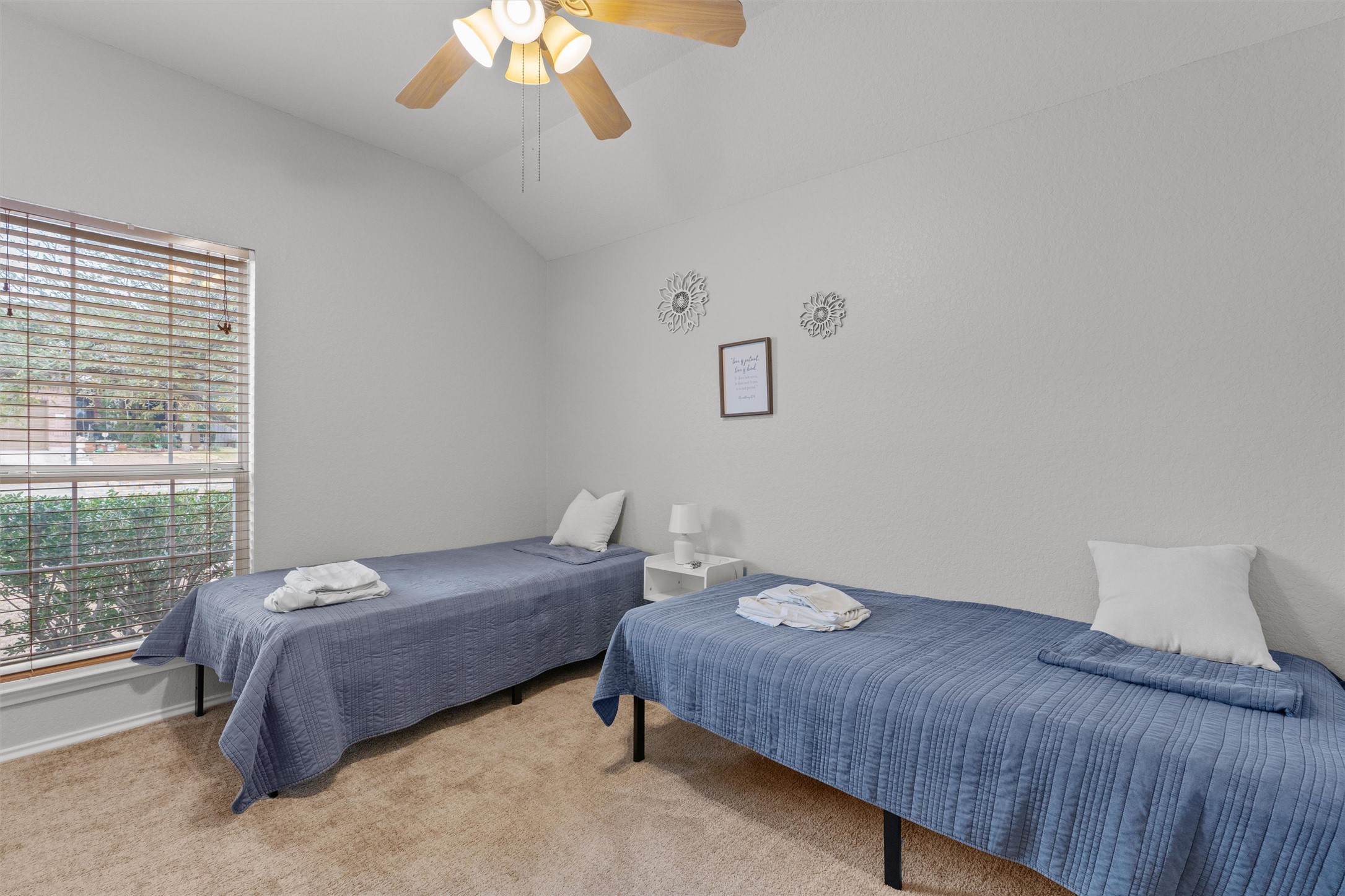 1587 Haynie Bend Round Rock, TX 78665 - Photo 18 of 25 a bedroom with a bed and a large window