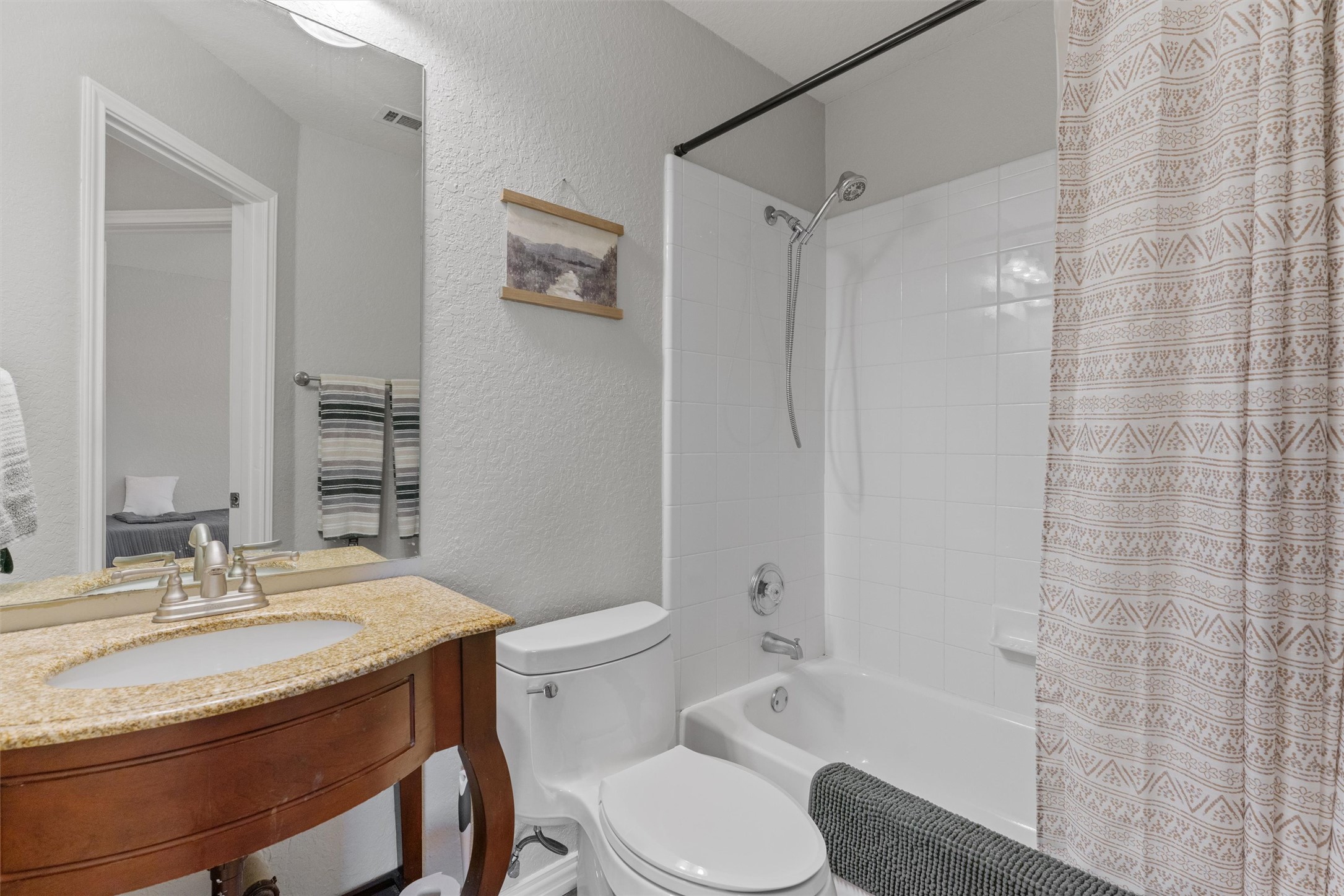1587 Haynie Bend Round Rock, TX 78665 - Photo 19 of 25 a bathroom with a sink toilet and shower