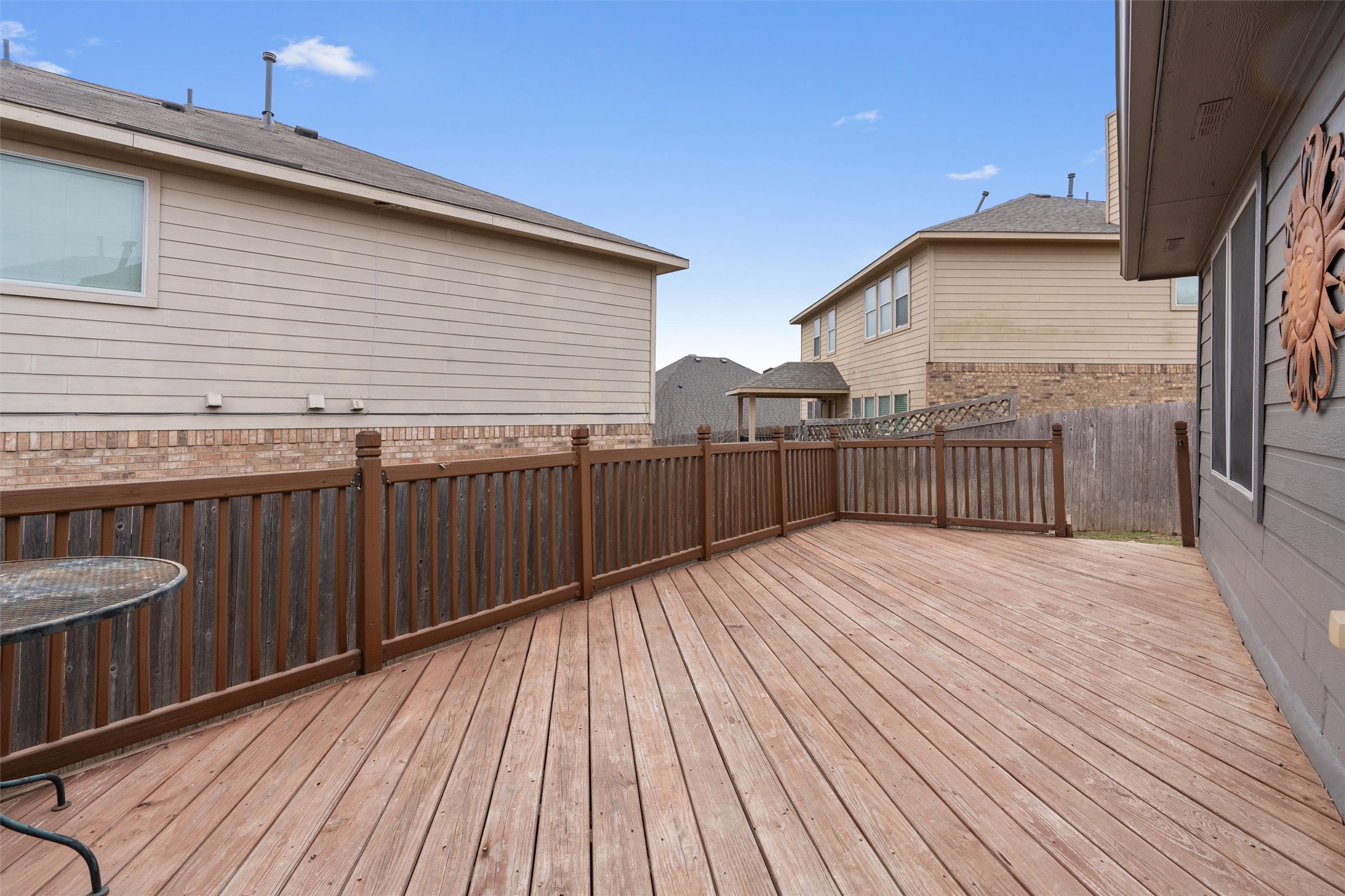 1587 Haynie Bend Round Rock, TX 78665 - Photo 21 of 25 a view of a wooden deck besides a house