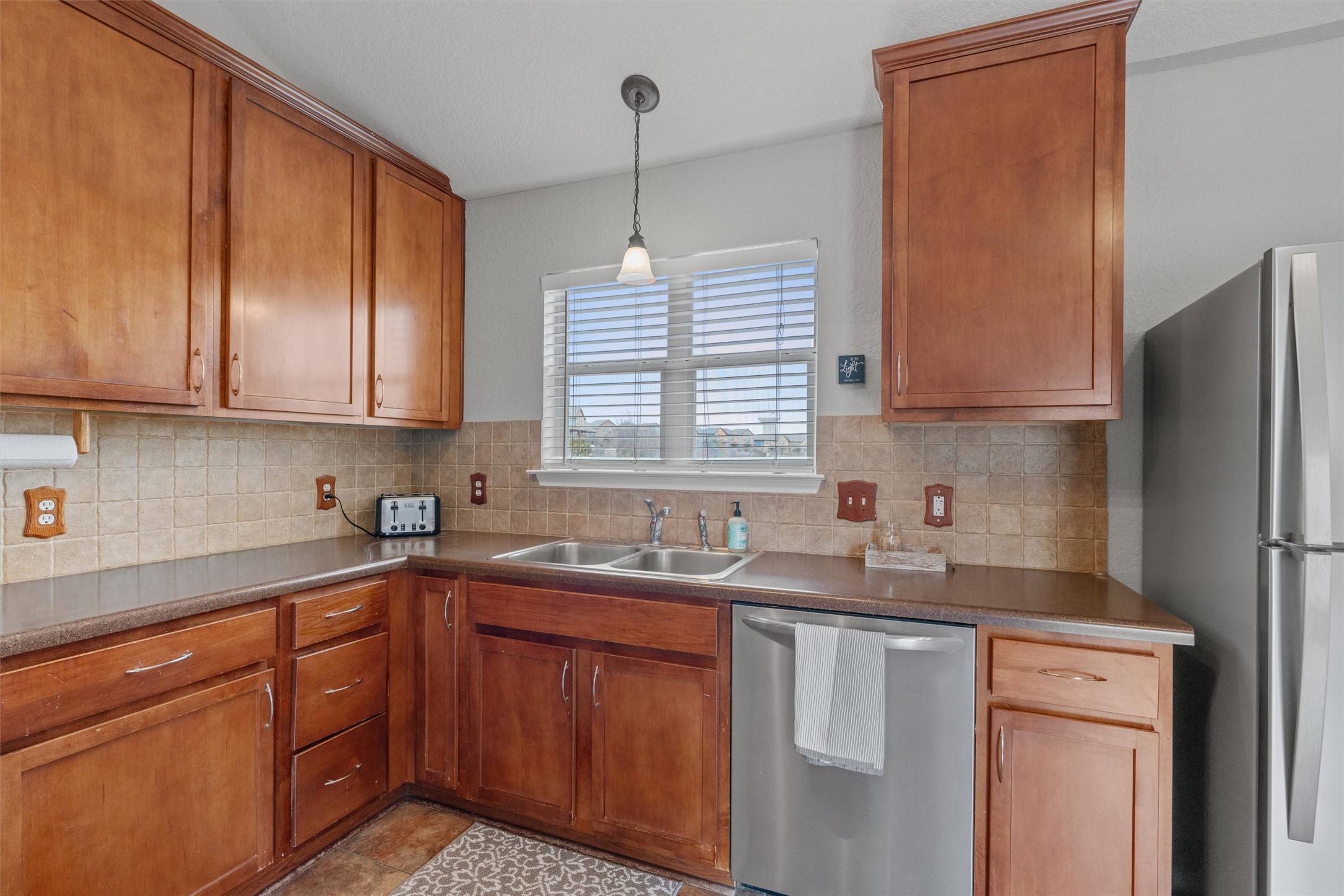 1587 Haynie Bend Round Rock, TX 78665 - Photo 10 of 25 a kitchen with a sink stove and cabinets