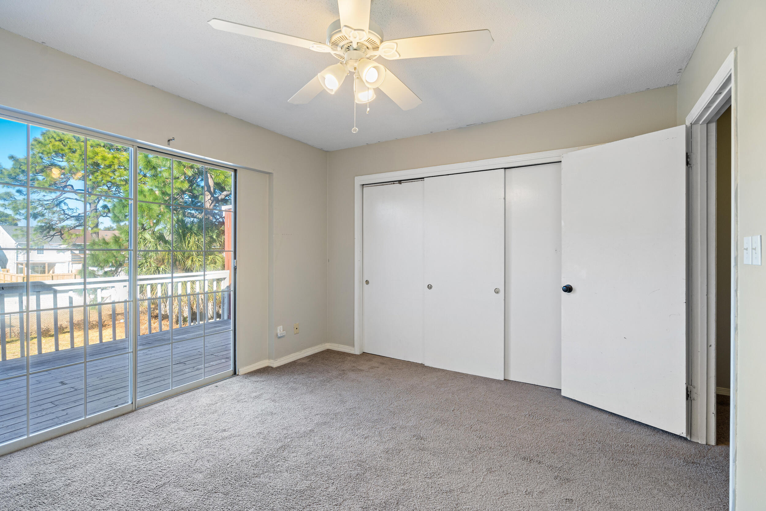145 4th Avenue, Unit C2 Shalimar, FL 32579 - Photo 17 of 35 a view of an empty room with a window