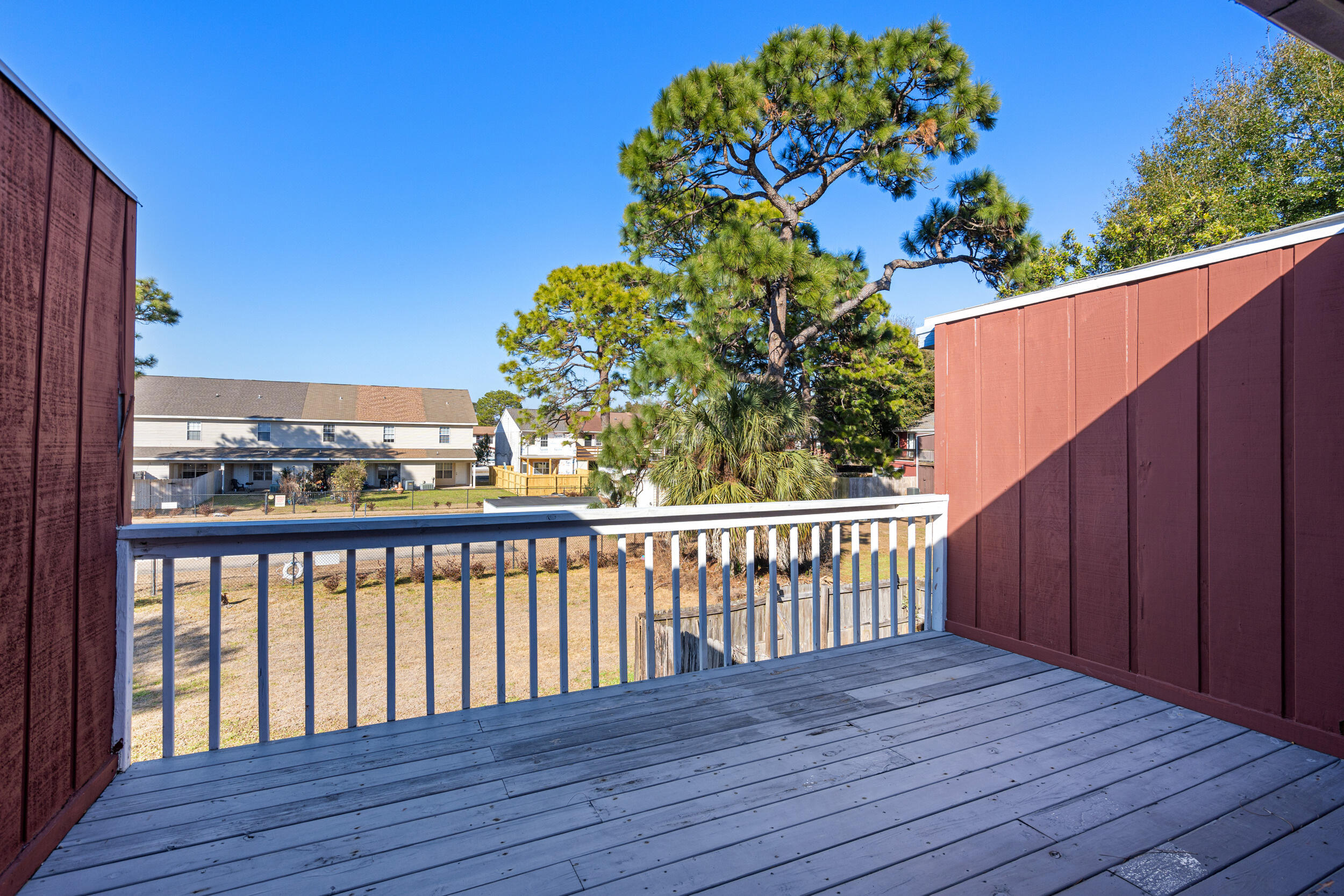 145 4th Avenue, Unit C2 Shalimar, FL 32579 - Photo 19 of 35 a view of a balcony with wooden floor