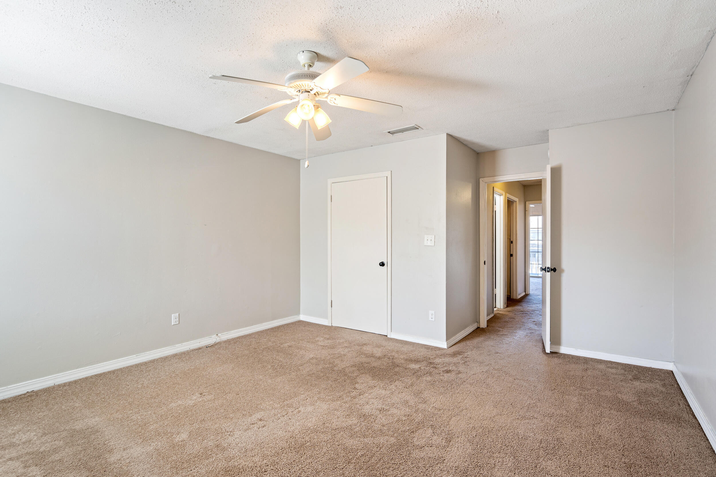145 4th Avenue, Unit C2 Shalimar, FL 32579 - Photo 22 of 35 a view of an empty room with a fan