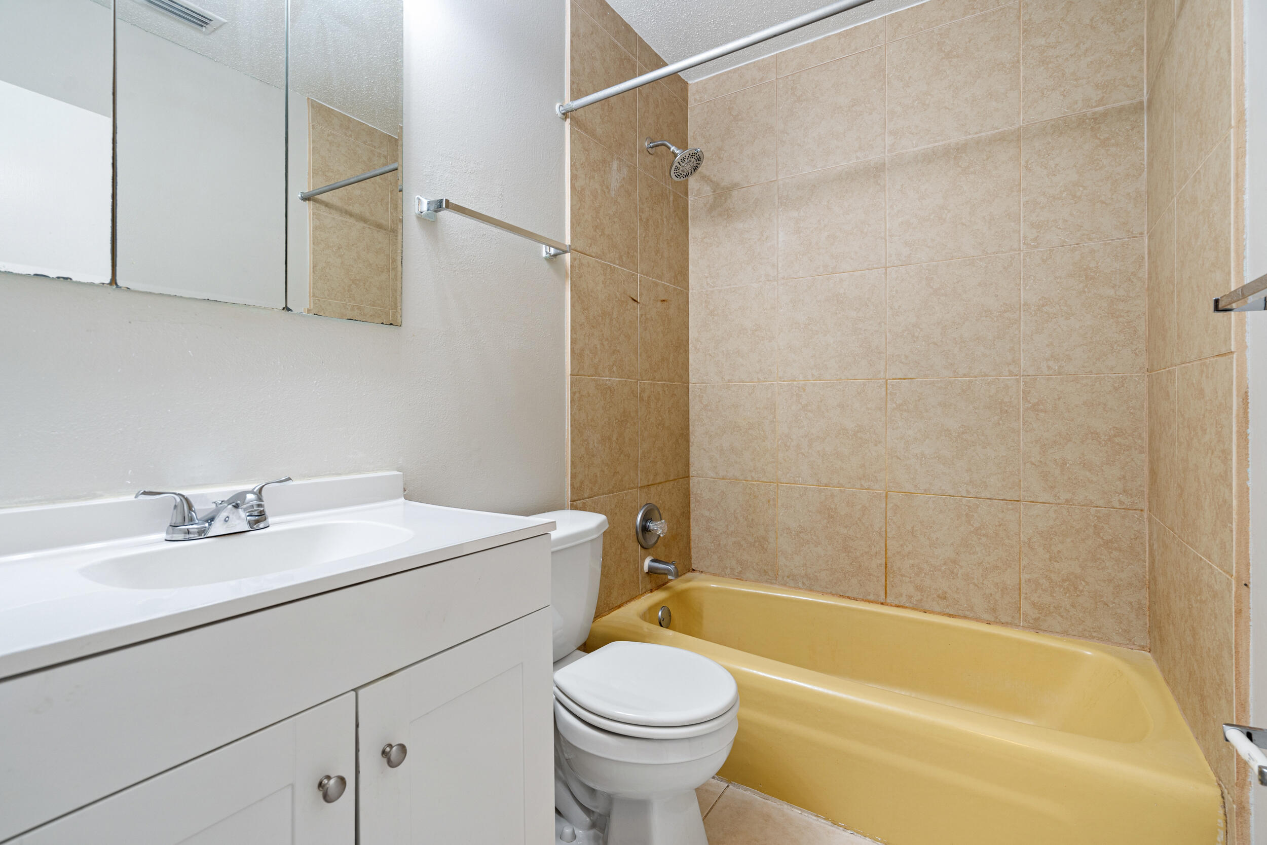 145 4th Avenue, Unit C2 Shalimar, FL 32579 - Photo 24 of 35 a bathroom with a sink a toilet and a bathtub