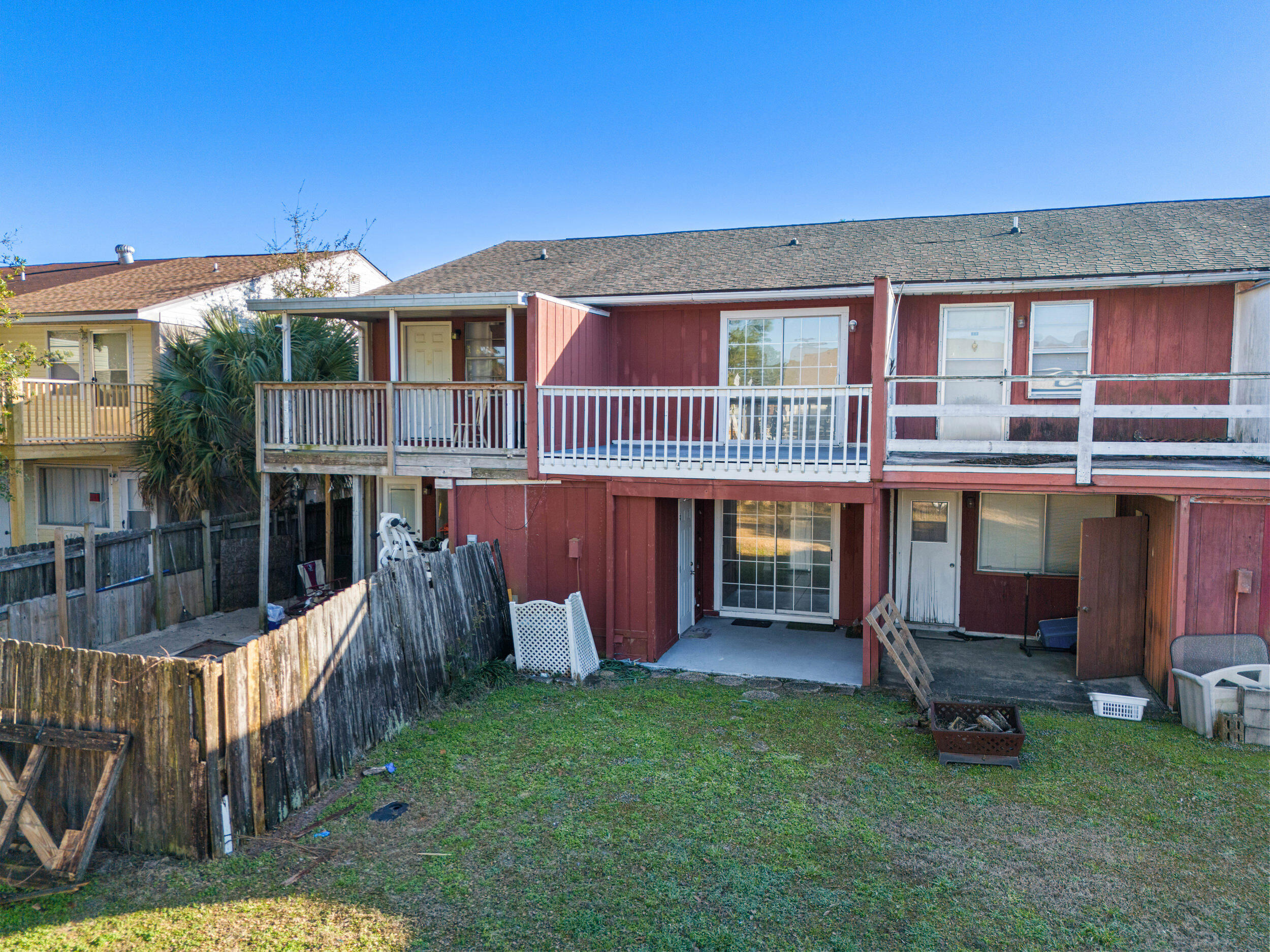 145 4th Avenue, Unit C2 Shalimar, FL 32579 - Photo 29 of 35 a view of a house with a yard and deck