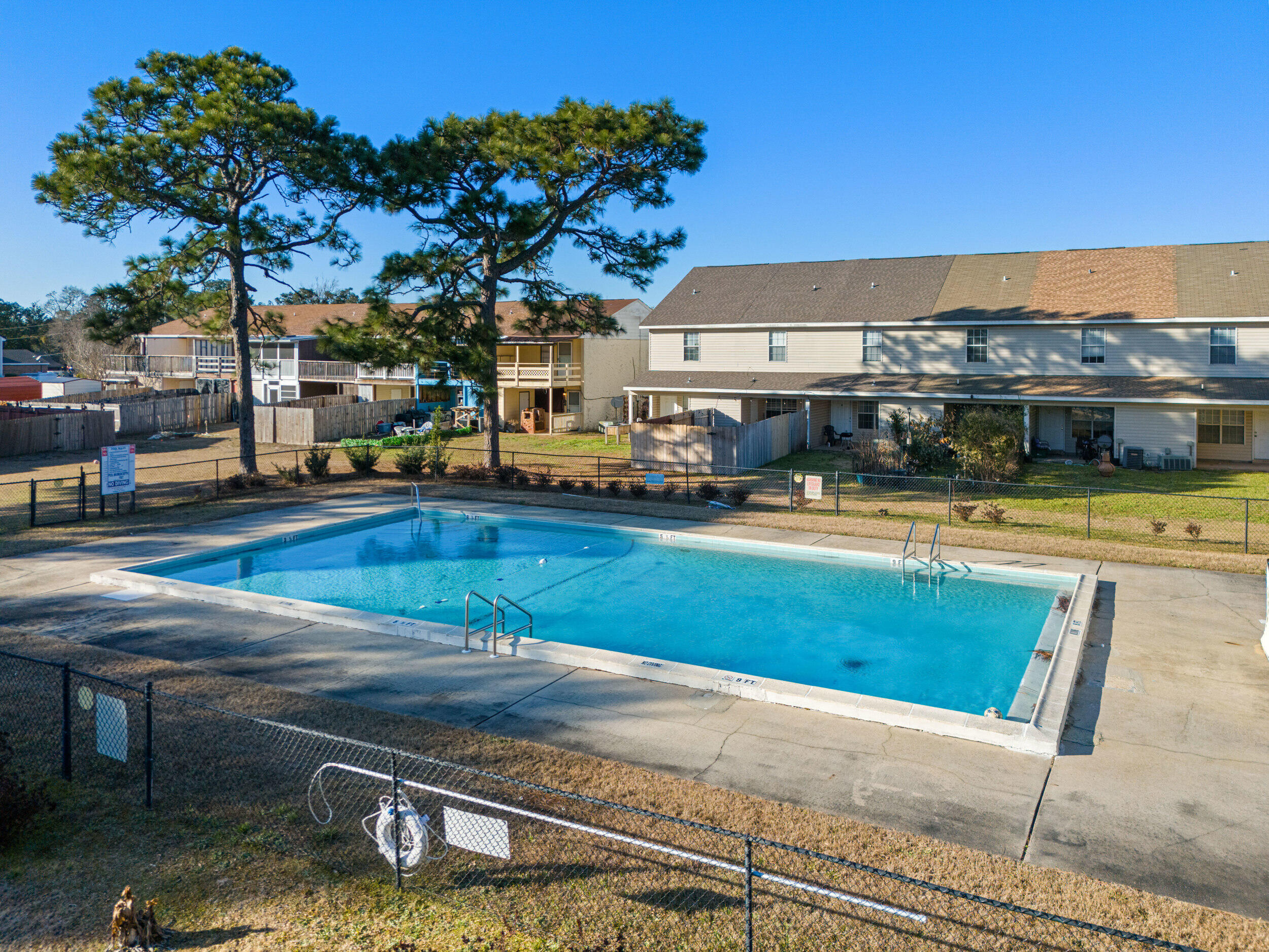 145 4th Avenue, Unit C2 Shalimar, FL 32579 - Photo 31 of 35 a view of a swimming pool with an outdoor seating