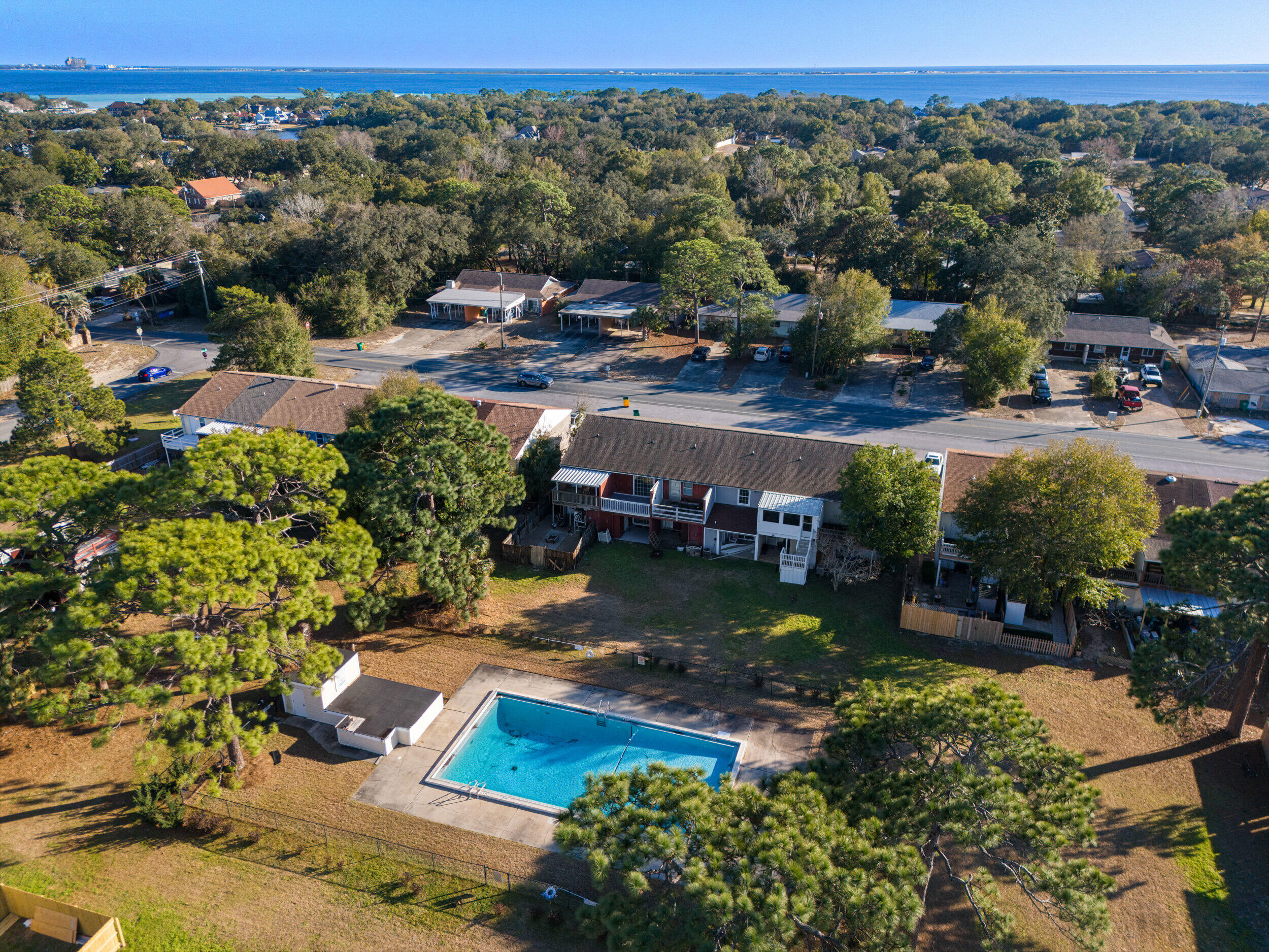145 4th Avenue, Unit C2 Shalimar, FL 32579 - Photo 33 of 35 an aerial view of a house with a garden and lake view