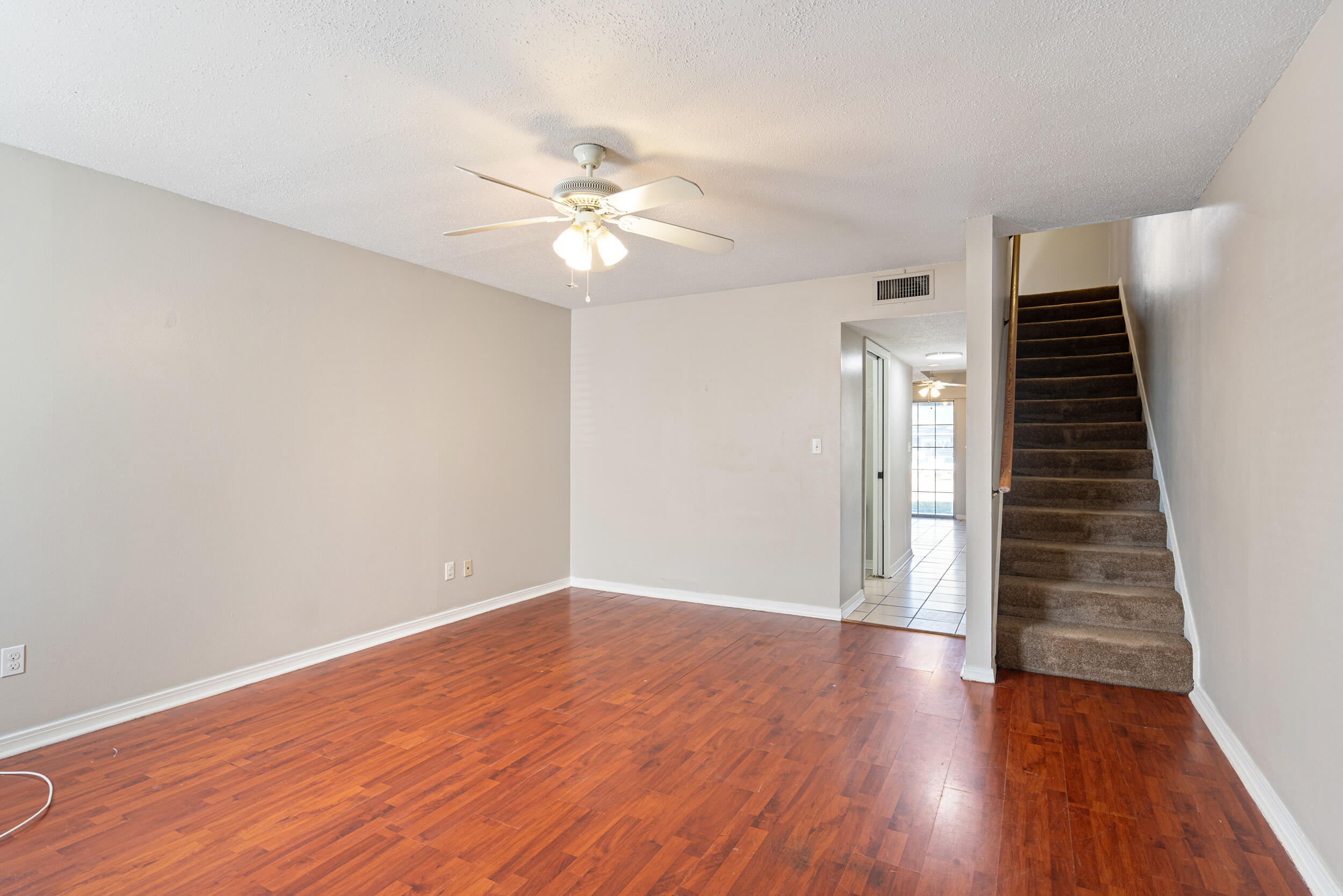 145 4th Avenue, Unit C2 Shalimar, FL 32579 - Photo 5 of 35 wooden floor in an empty room with a window
