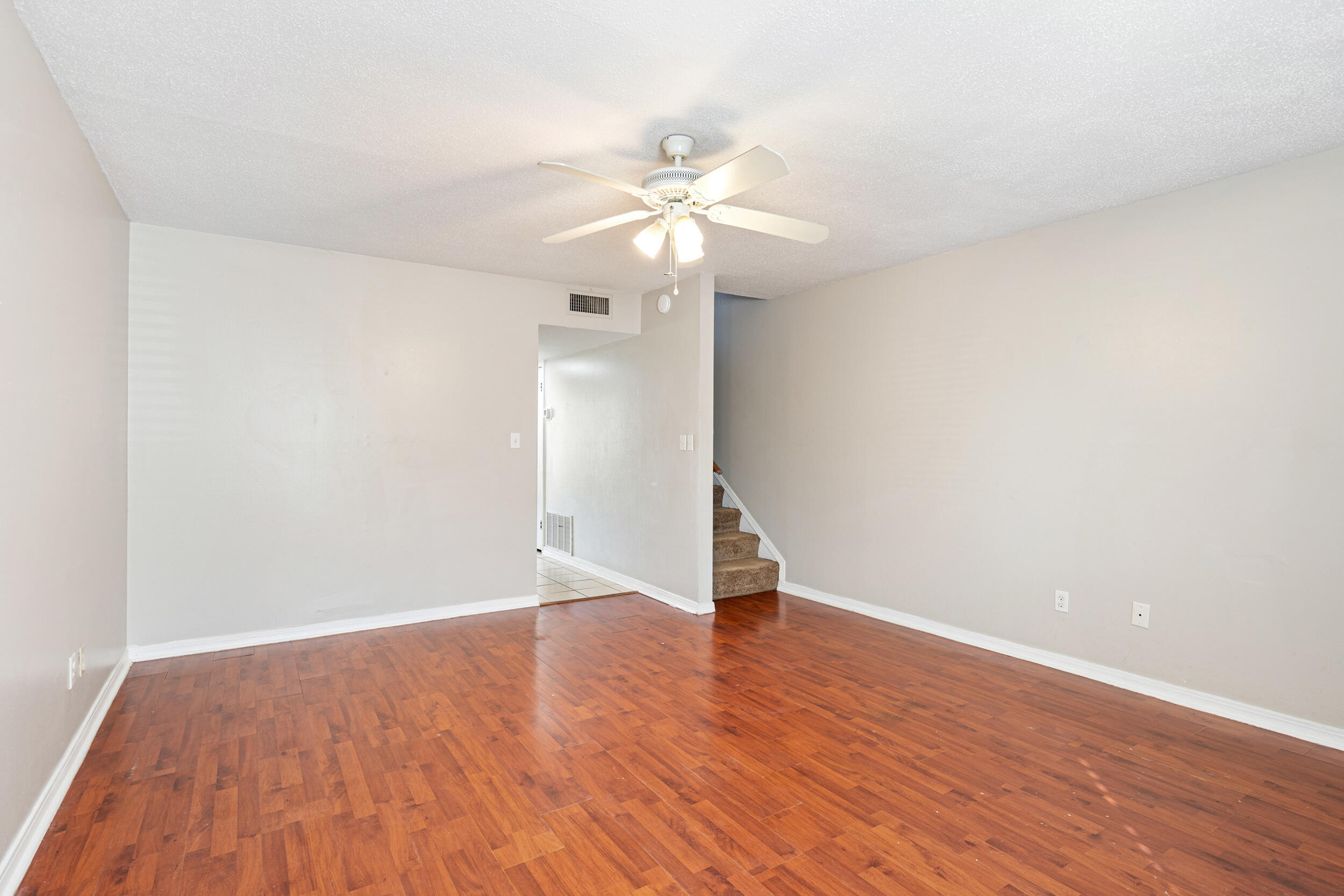 145 4th Avenue, Unit C2 Shalimar, FL 32579 - Photo 6 of 35 a view of an empty room with wooden floor