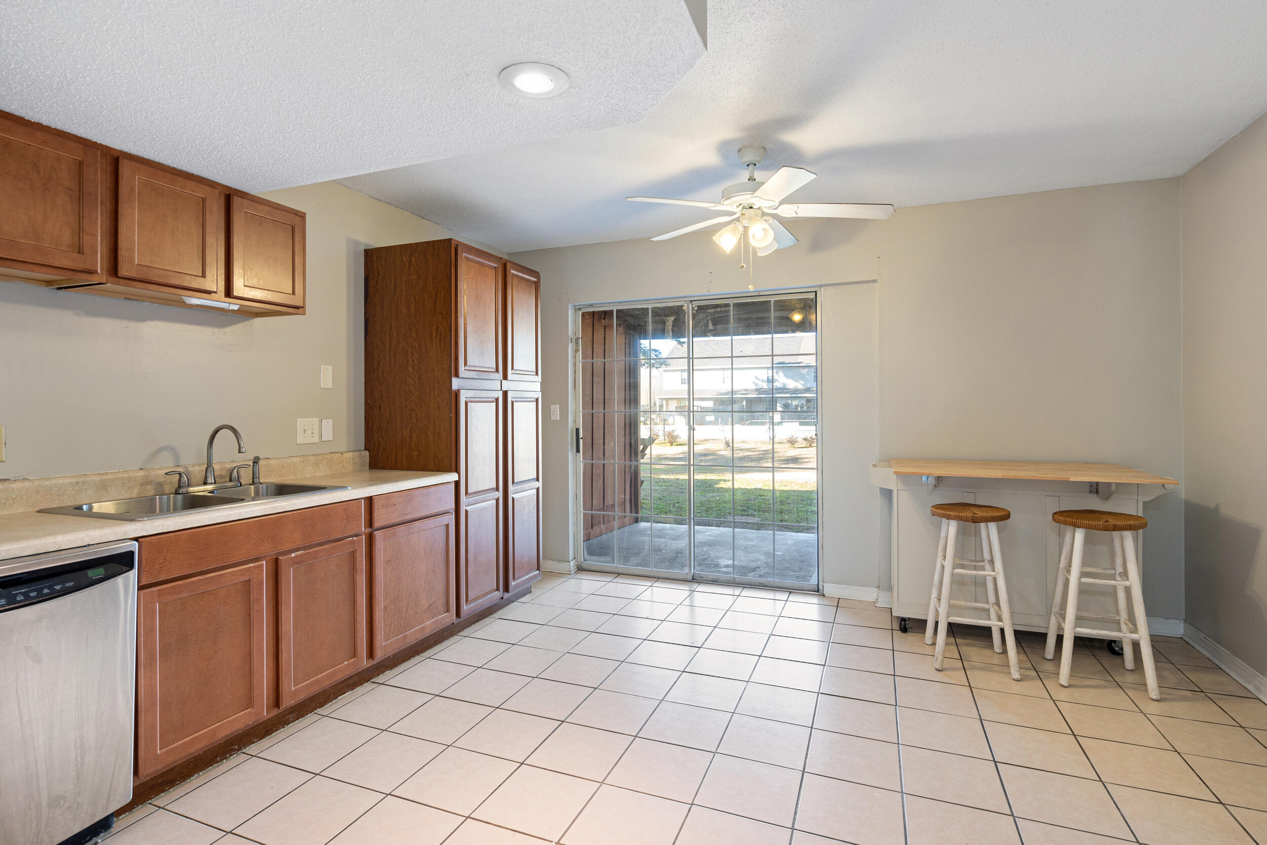145 4th Avenue, Unit C2 Shalimar, FL 32579 - Photo 7 of 35 a kitchen with stainless steel appliances granite countertop a sink and cabinets