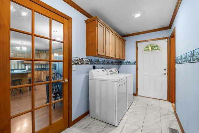 a utility room with dryer and washer