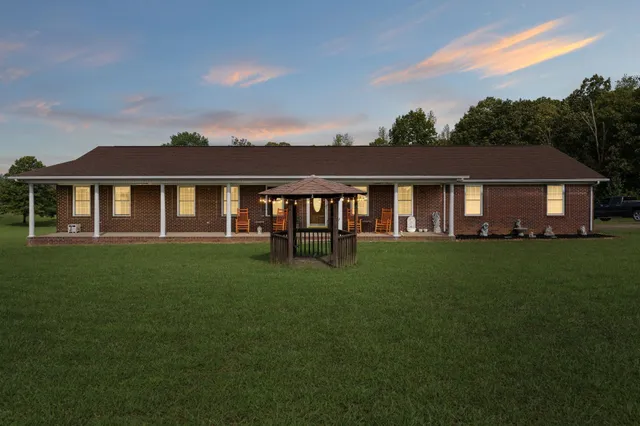 a view of a house with a big yard