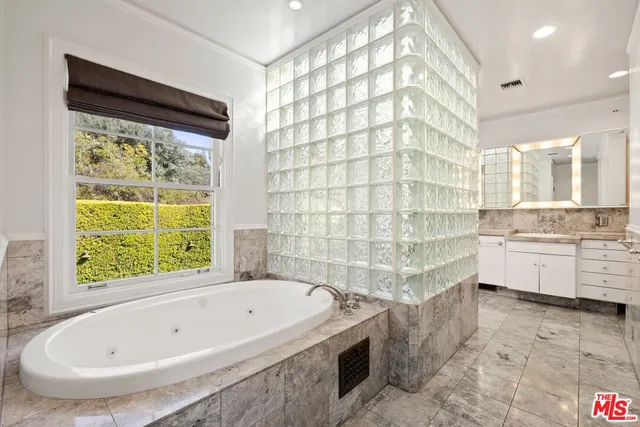 a bathroom with a bathtub and a sink