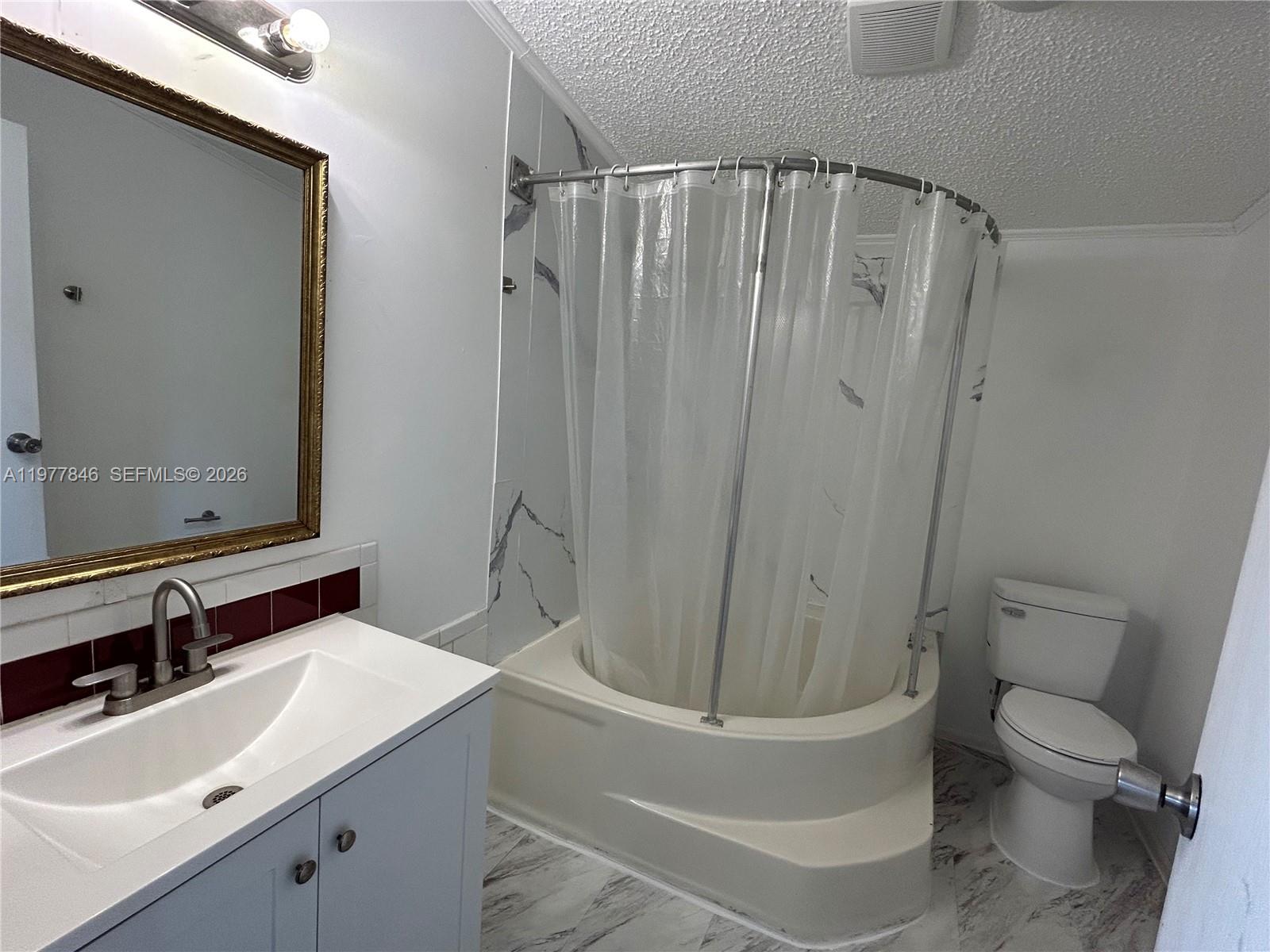 10467 South 228th Lane, Unit A Boca Raton, FL 33428 - Photo 20 of 27 a bathroom with a sink toilet and shower