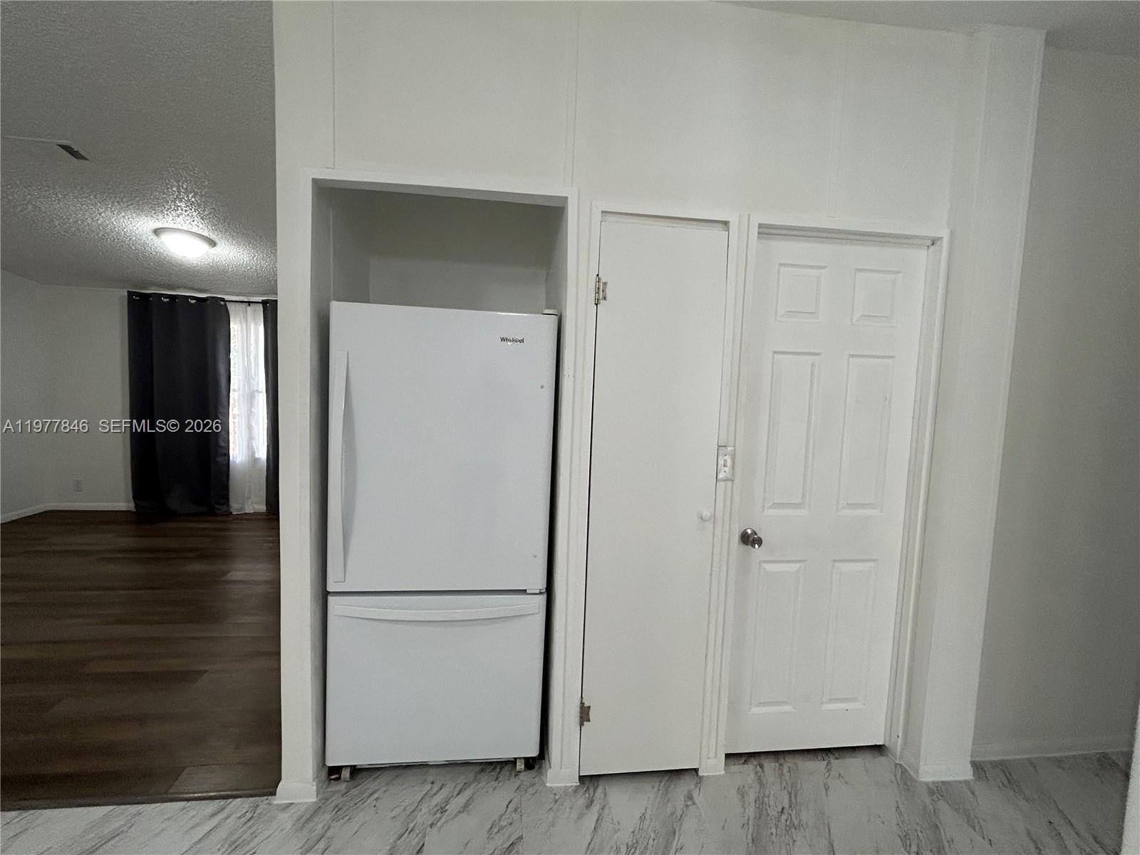 10467 South 228th Lane, Unit A Boca Raton, FL 33428 - Photo 6 of 27 a view of a hallway with wooden floor