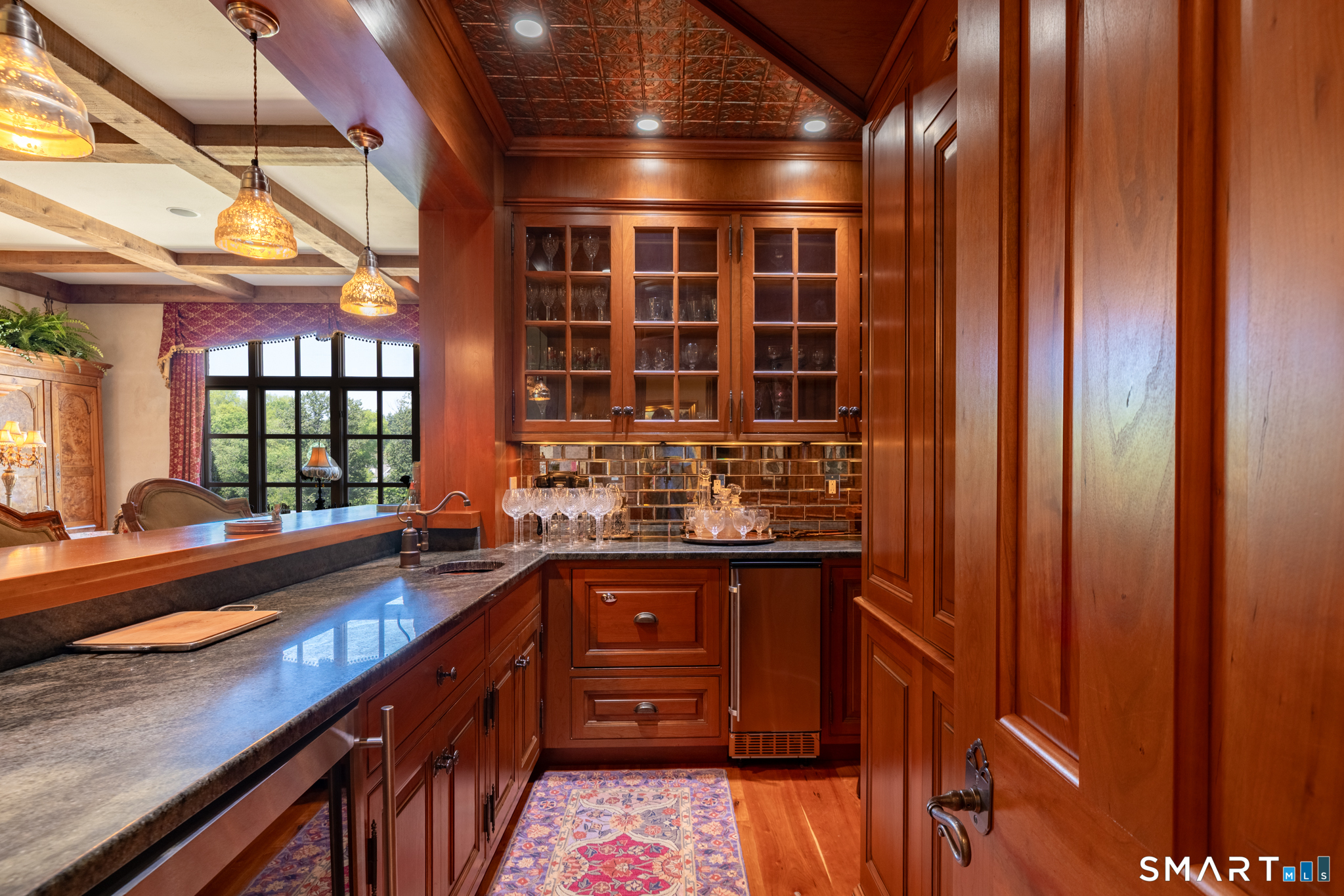 7 Equestrian Ridge Newtown, CT 06470 - Photo 15 of 40 a kitchen with stainless steel appliances granite countertop a sink and wooden cabinets